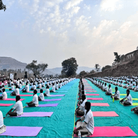 Yogotsav 2024 poster featuring people practicing yoga.