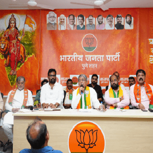 A group of people discussing around a table, symbolizing the collaboration between the BJP and local businesses