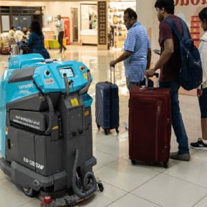 A futuristic-looking intelligent cleaning robot at Ahmedabad Airport.